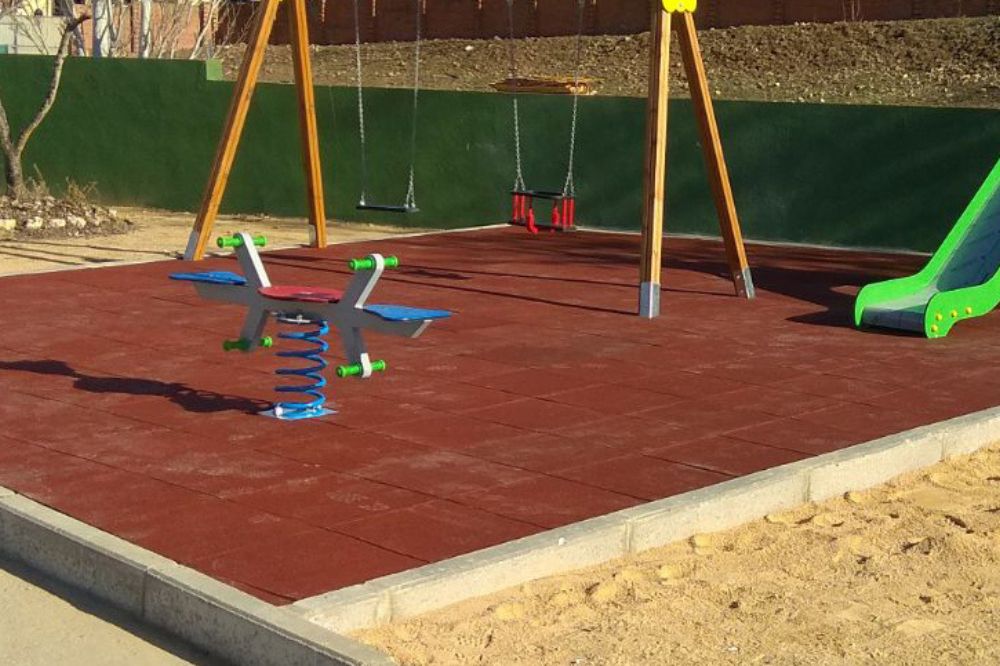 suelo caucho parque infantil